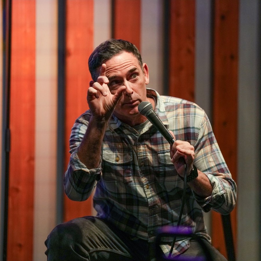 Andy Hendrickson mid-joke on stage