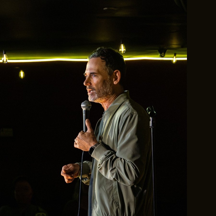Andy Hendrickson performing in profile